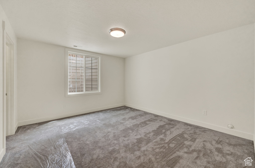 Unfurnished room featuring carpet floors