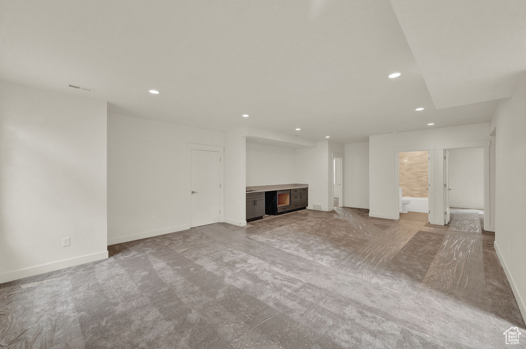 Unfurnished living room with carpet