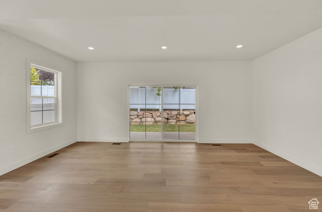 Spare room with light hardwood / wood-style flooring