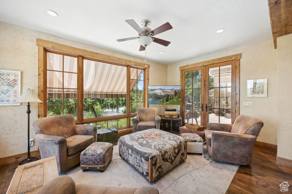 Living room with hardwood / wood-style floors, ceiling fan, and french doors