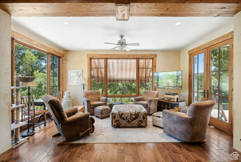 Living room with hardwood / wood-style floors, ceiling fan, and french doors