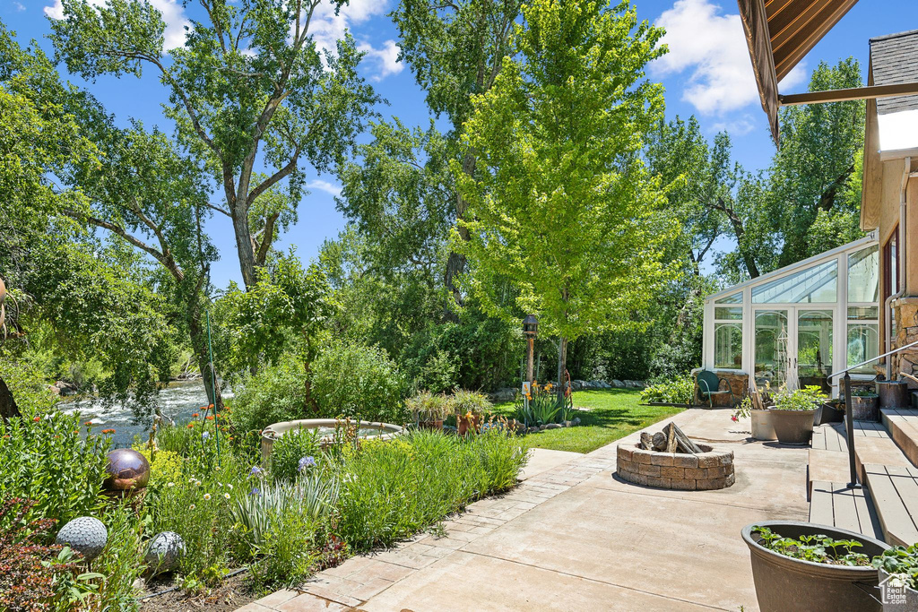 View of patio / terrace with an outdoor fire pit