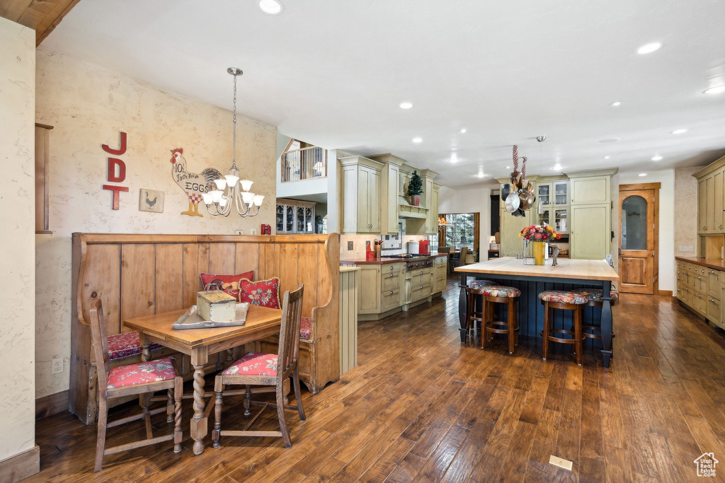 Dining room featuring a chandelier and dark hardwood / wood-style flooring