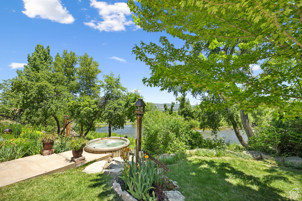 View of yard with a water view