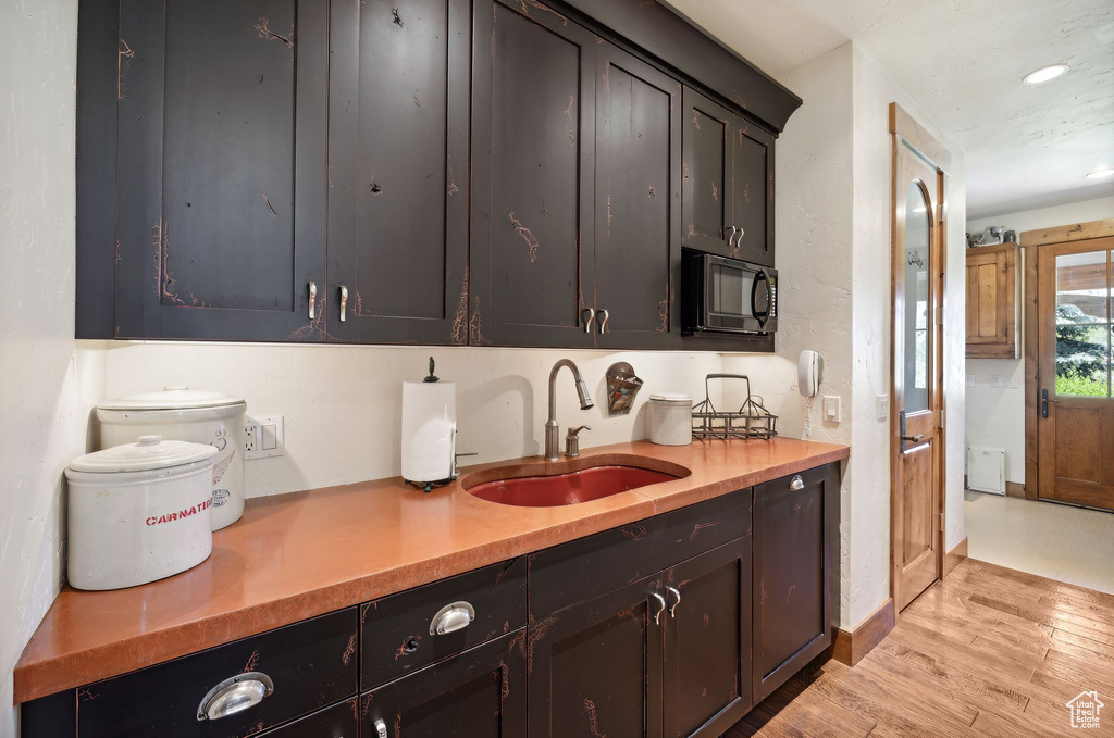 Kitchen featuring sink and light hardwood / wood-style flooring