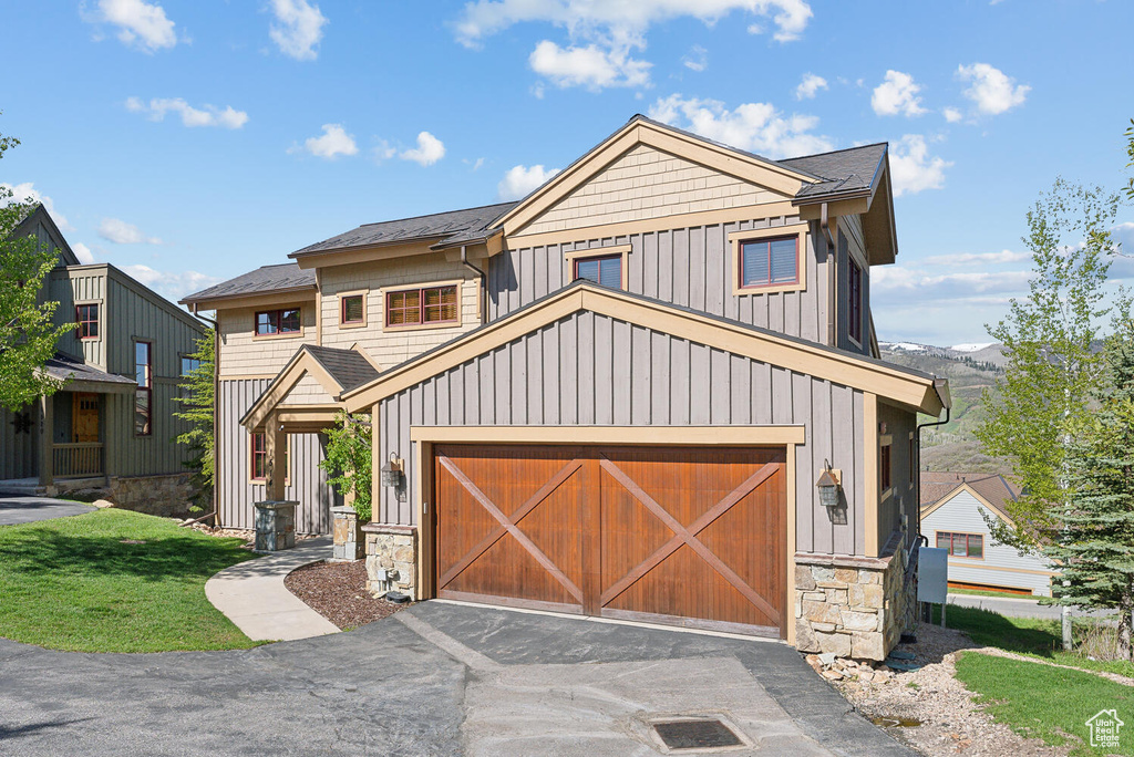 View of front of home featuring a garage