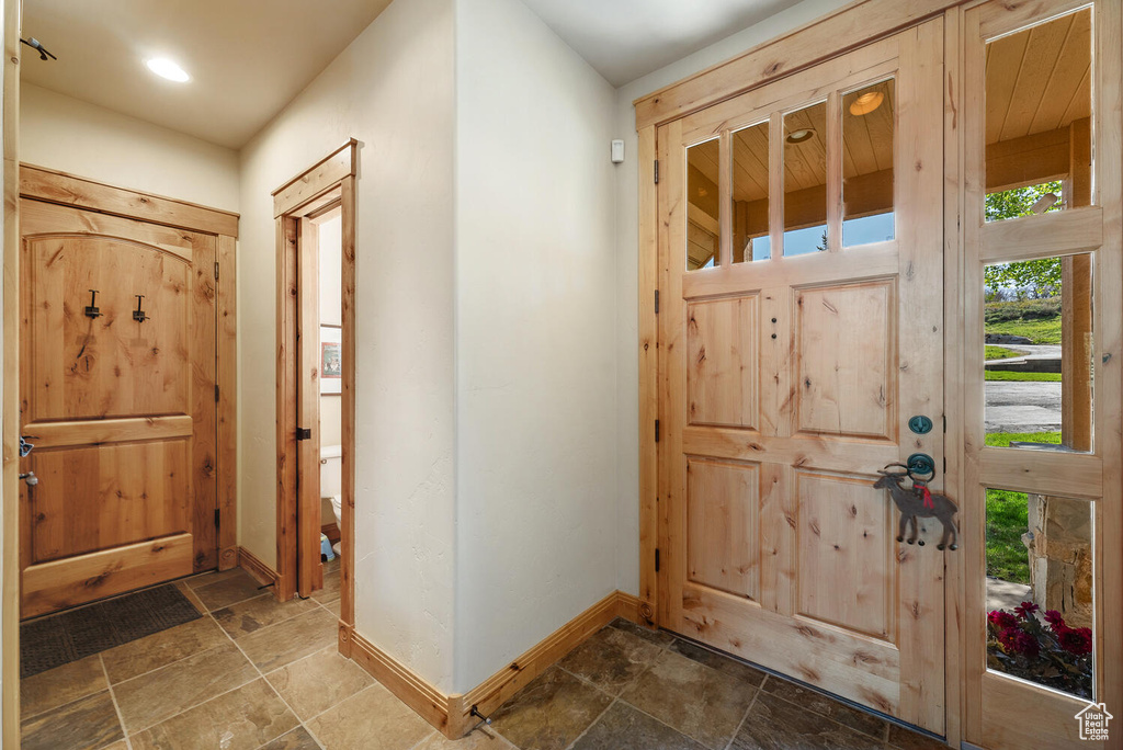 Entrance foyer featuring tile flooring