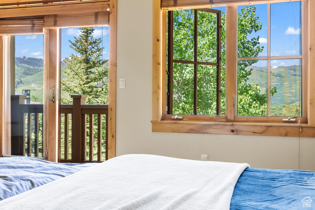 Bedroom featuring multiple windows