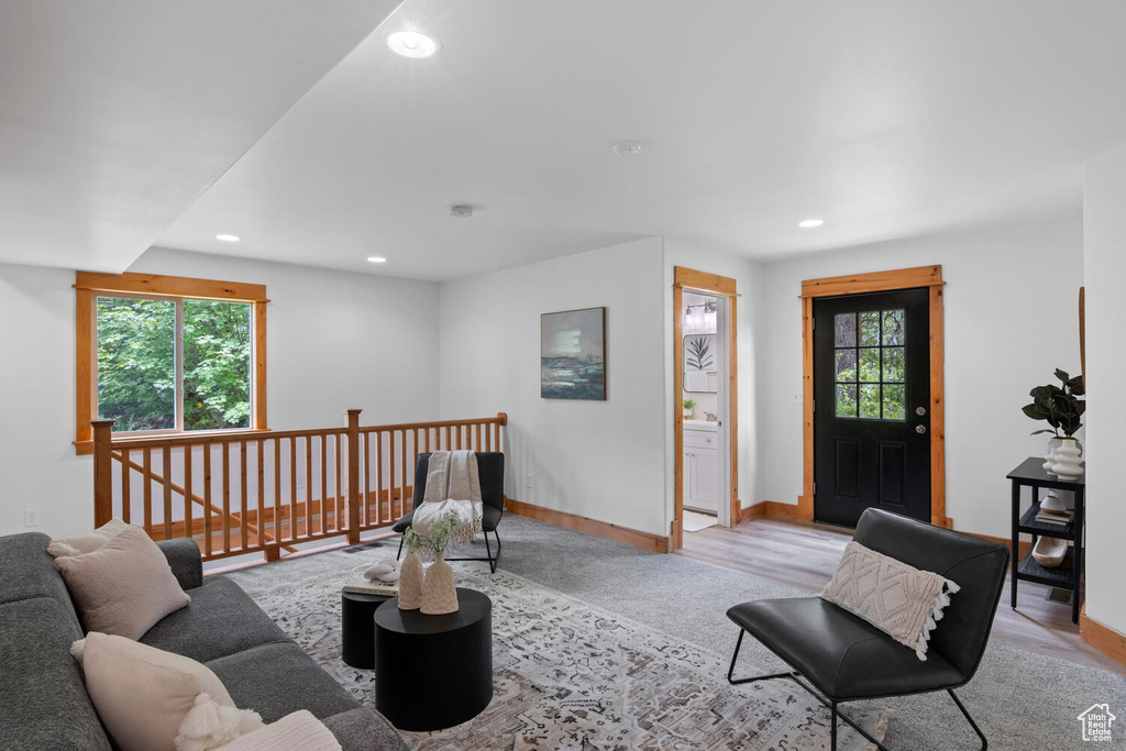 Living room with light hardwood / wood-style floors