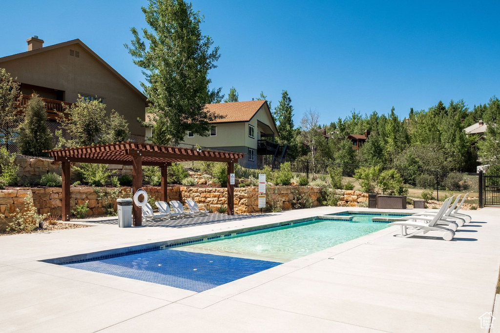 View of pool with a pergola