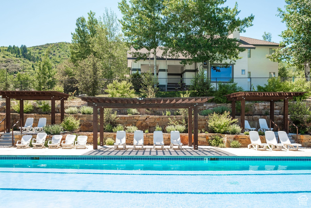 View of pool featuring a pergola