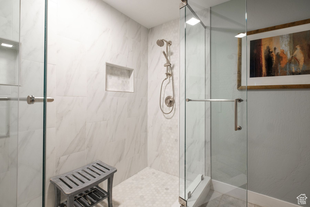 Bathroom with a shower with shower door