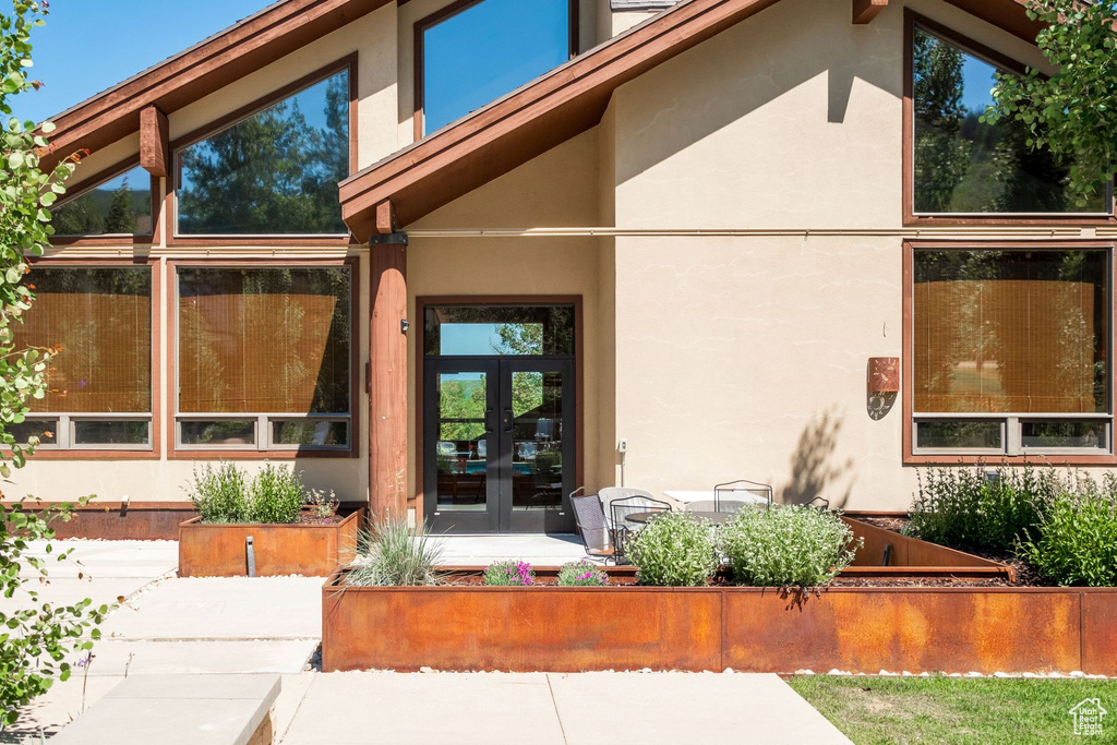 Doorway to property featuring french doors