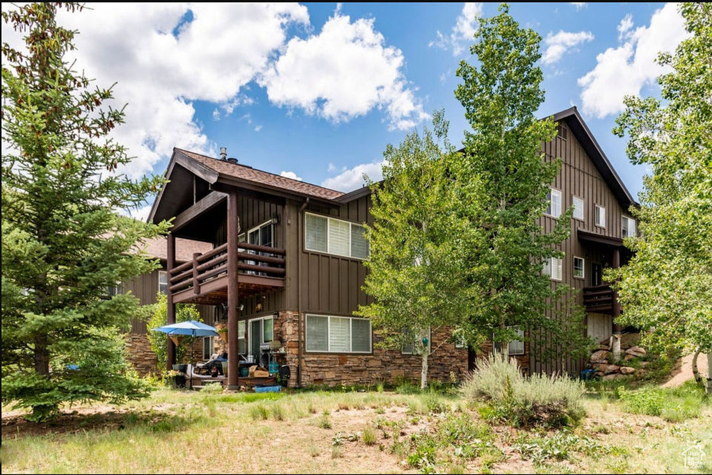 Back of house featuring a balcony