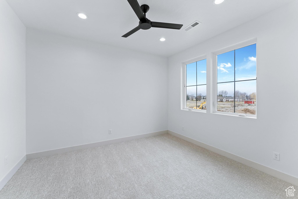 Unfurnished room with carpet floors and ceiling fan