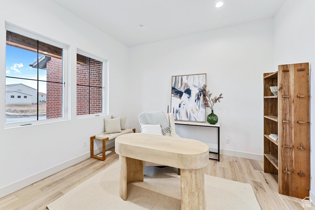 Office with light wood-type flooring