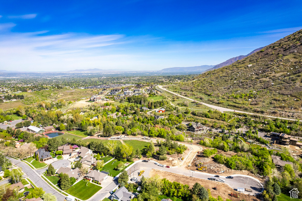 Birds eye view of property with a mountain view