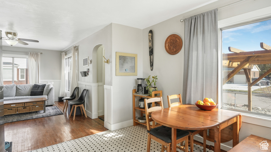 Dining space featuring ceiling fan and hardwood / wood-style flooring