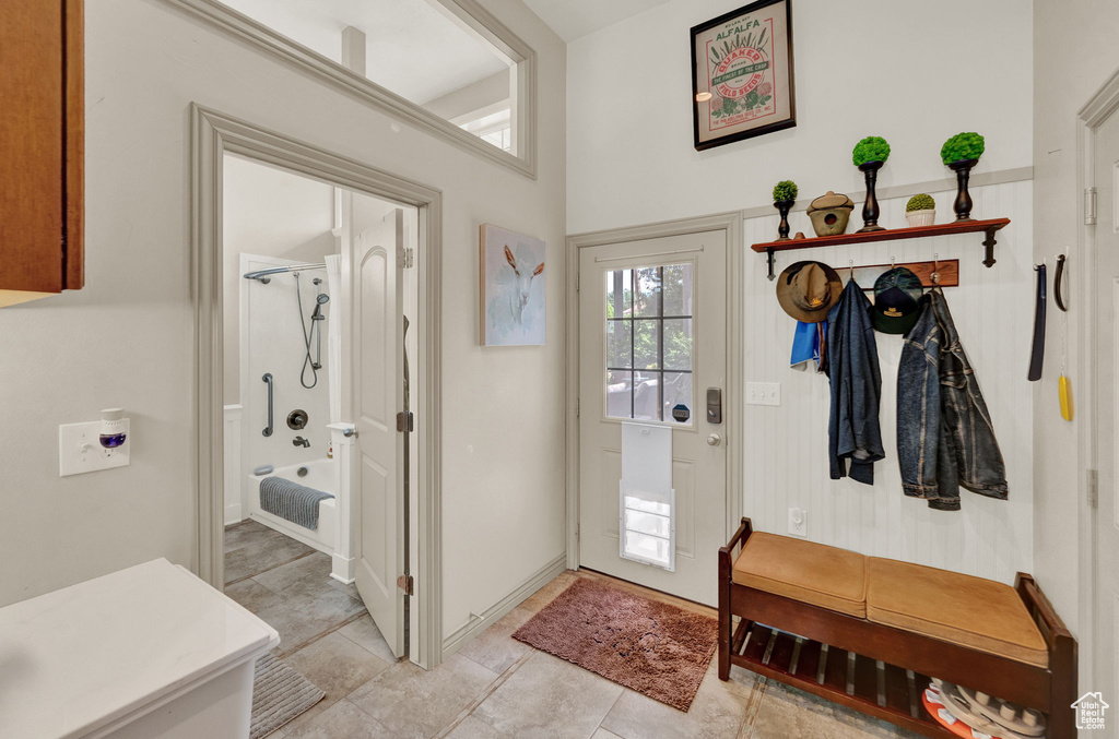 Mudroom featuring light tile flooring