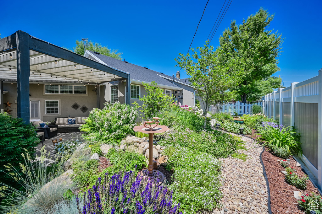 Exterior space with a patio, a pergola, and an outdoor hangout area