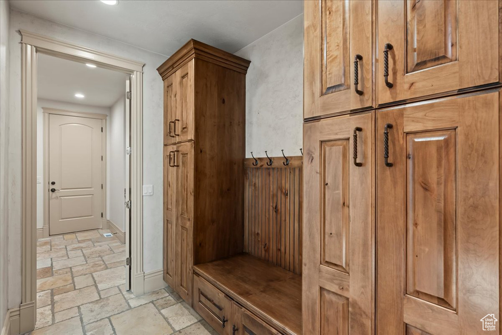 Mudroom with light tile floors