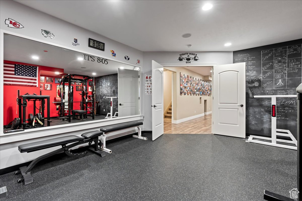 Gym with hardwood / wood-style floors