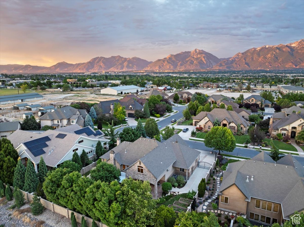 Aerial view at dusk featuring a mountain view