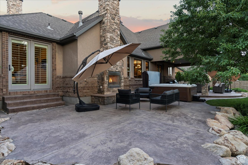 Exterior space with an outdoor hangout area and a patio area