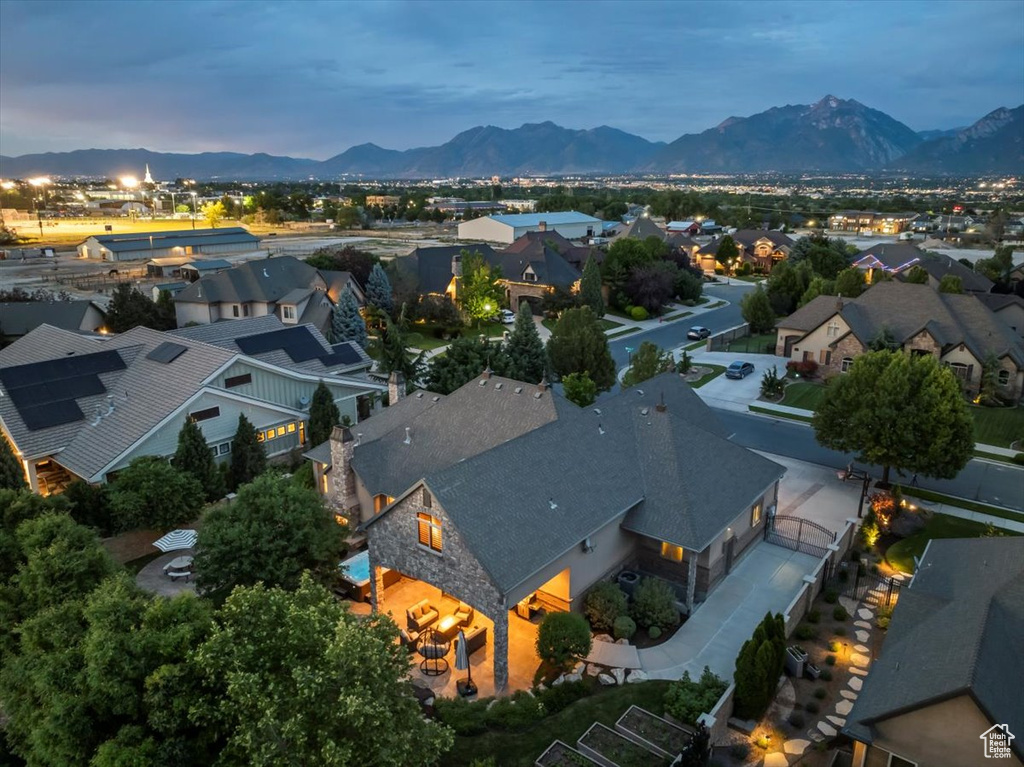 Aerial view at dusk featuring a mountain view