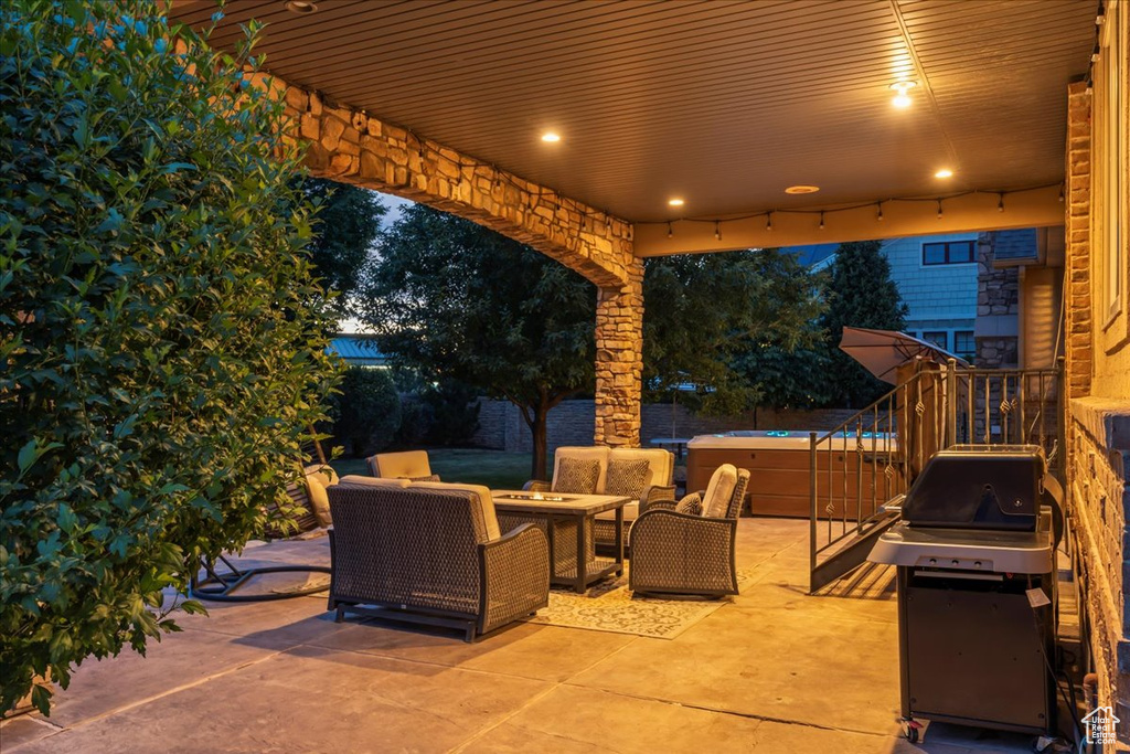 View of patio with a grill and an outdoor living space