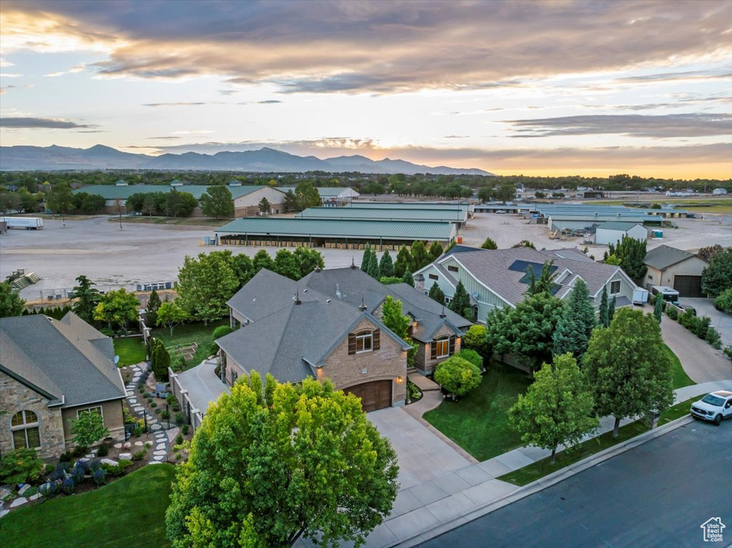 Aerial view at dusk featuring a mountain view