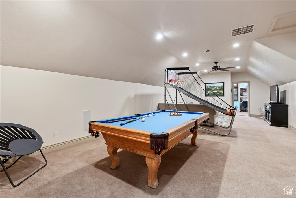 Game room featuring vaulted ceiling, light carpet, pool table, and ceiling fan