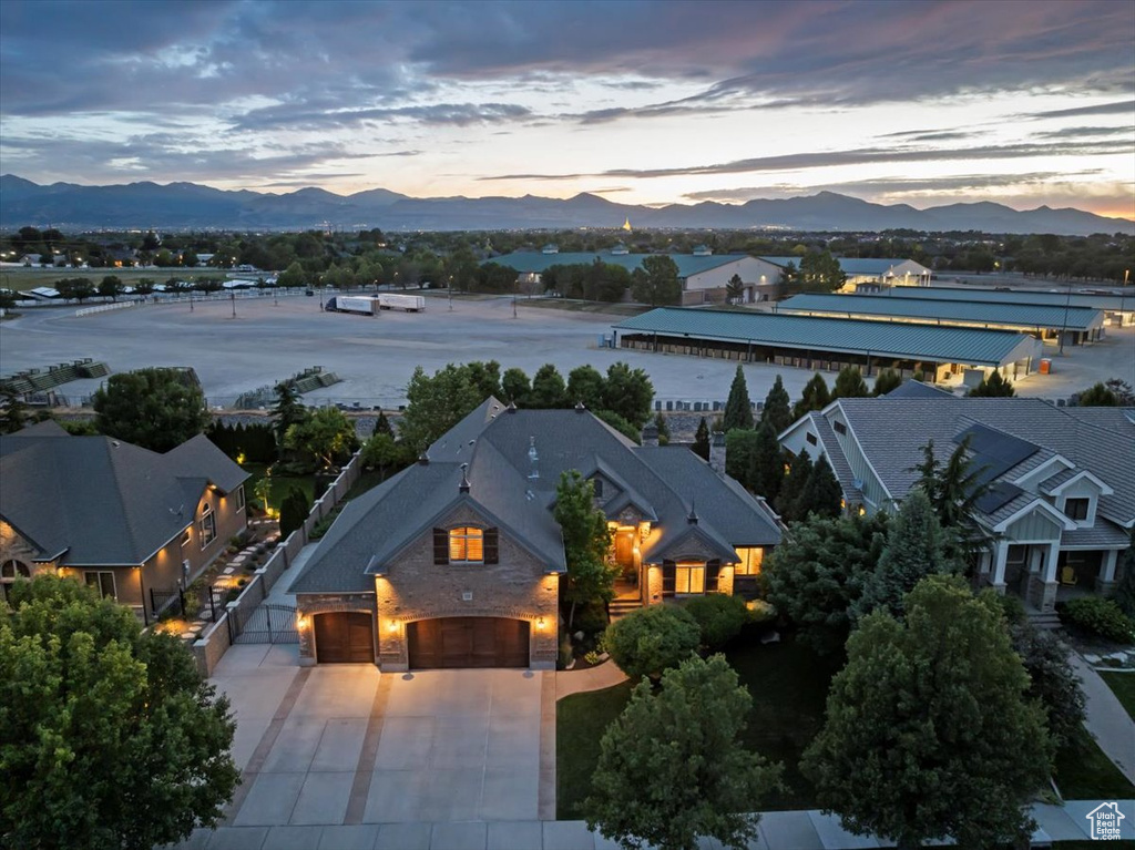 Aerial view at dusk featuring a mountain view