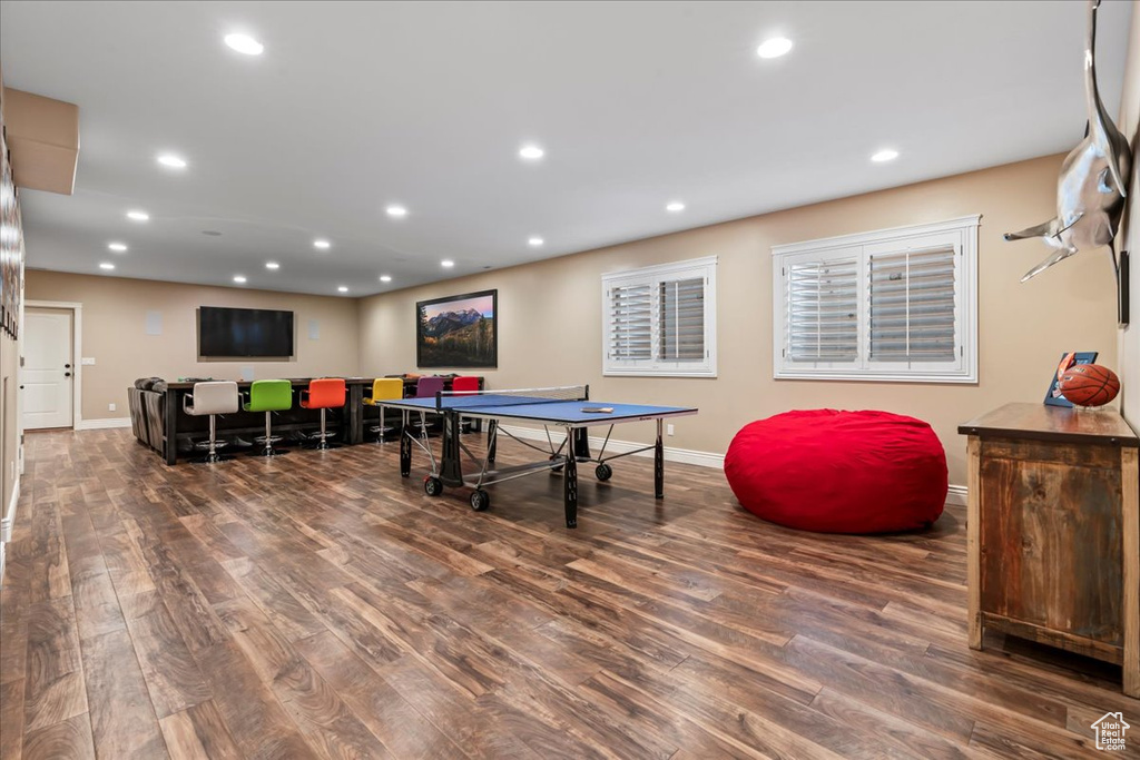 Playroom with dark hardwood / wood-style flooring