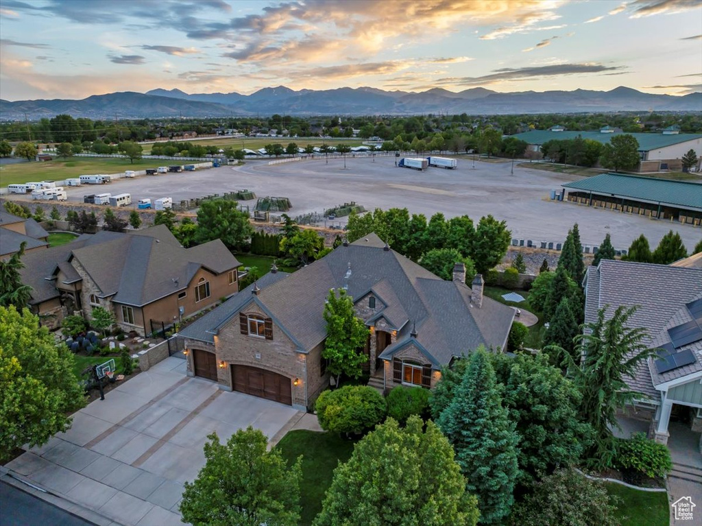 Aerial view at dusk featuring a mountain view