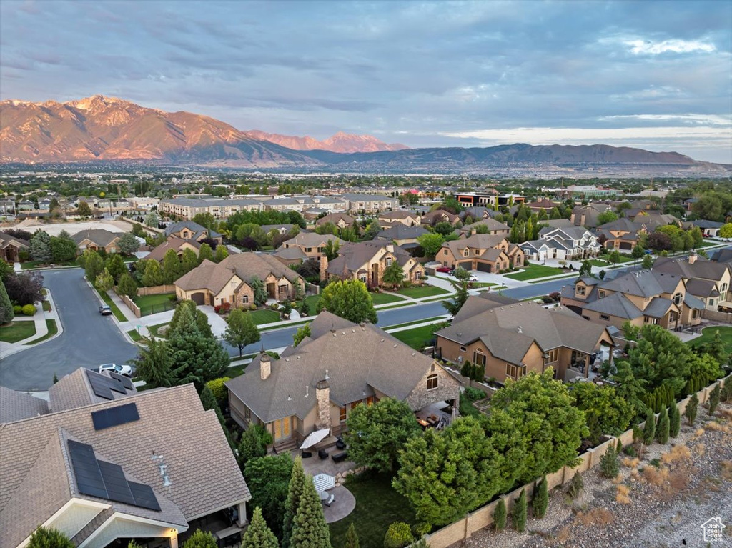 Birds eye view of property with a mountain view