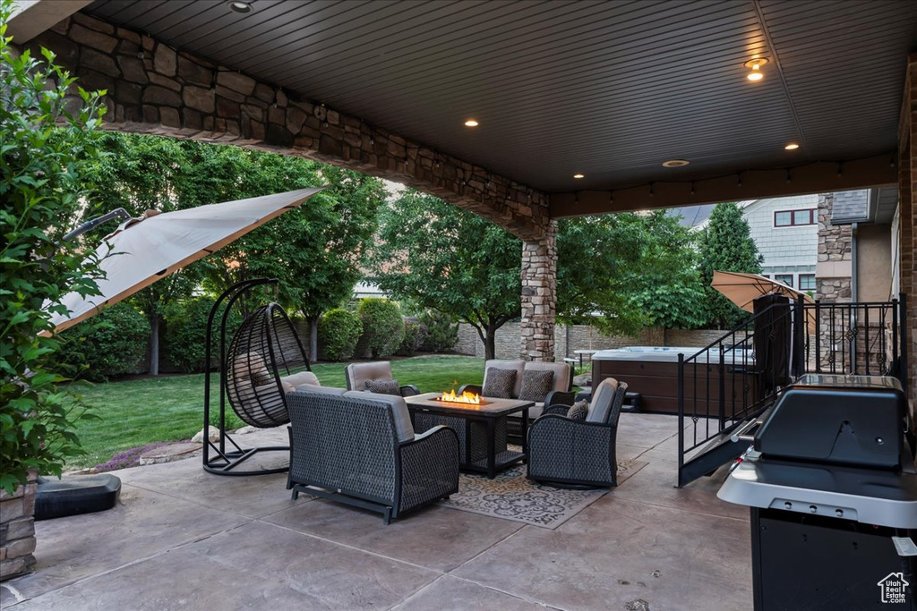 View of patio / terrace featuring an outdoor living space with a fire pit