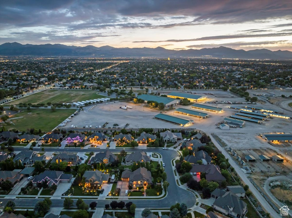 Aerial view at dusk featuring a mountain view