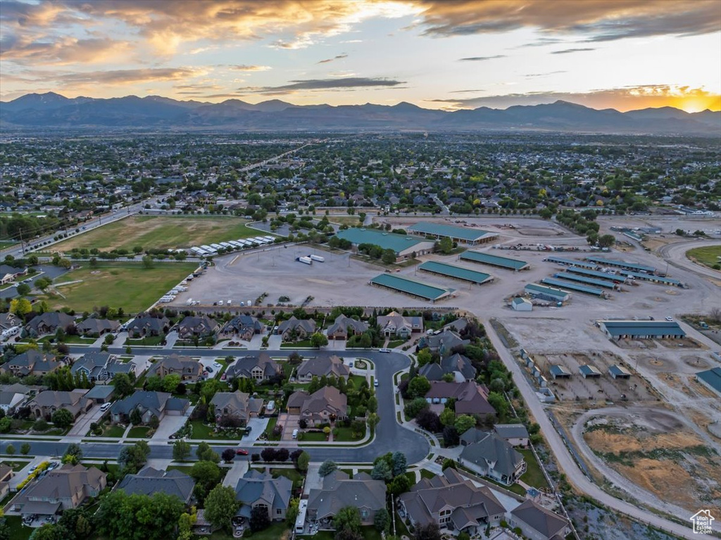 Aerial view at dusk featuring a mountain view