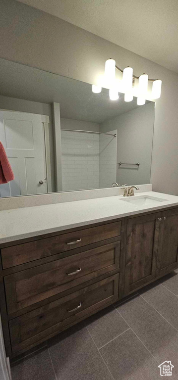 Bathroom with tile floors and oversized vanity