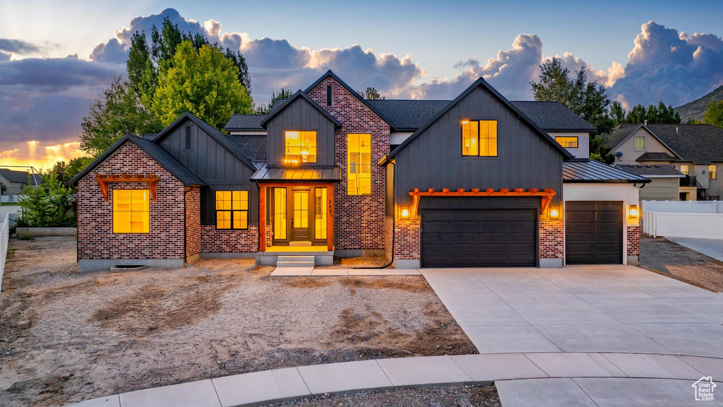 View of front of property with a garage