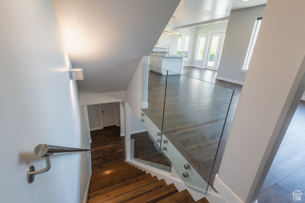 Stairs with hardwood / wood-style flooring