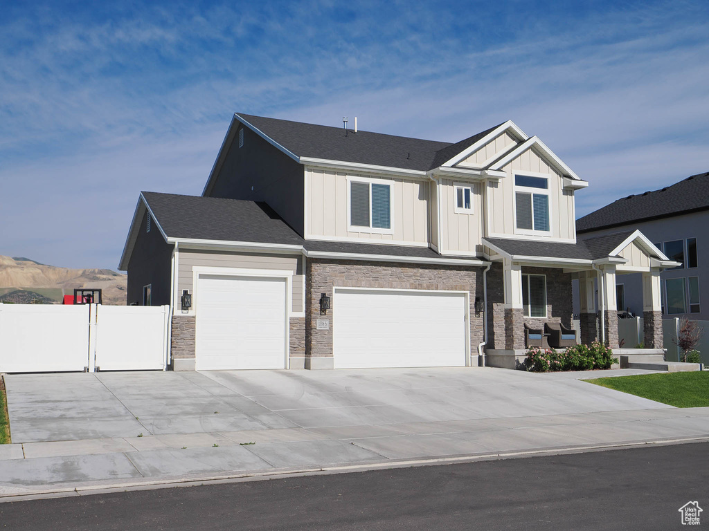 Craftsman inspired home featuring a garage