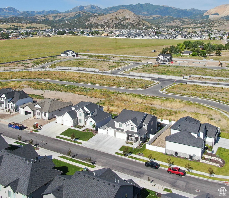 Birds eye view of property with a mountain view