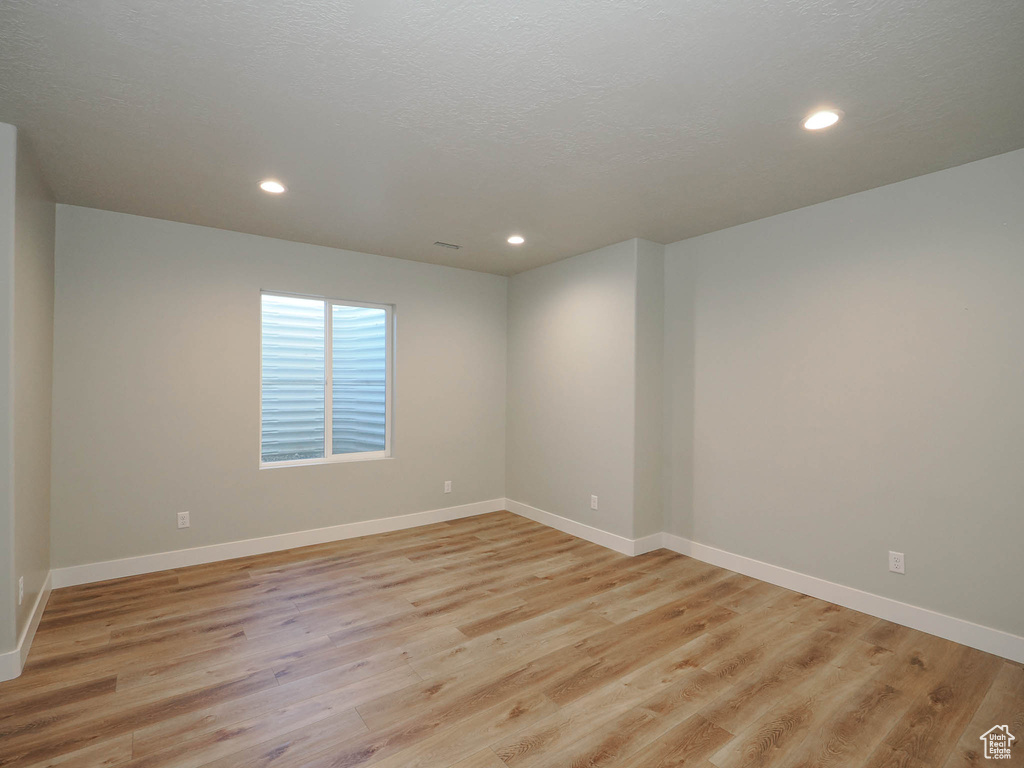 Empty room featuring light hardwood / wood-style flooring