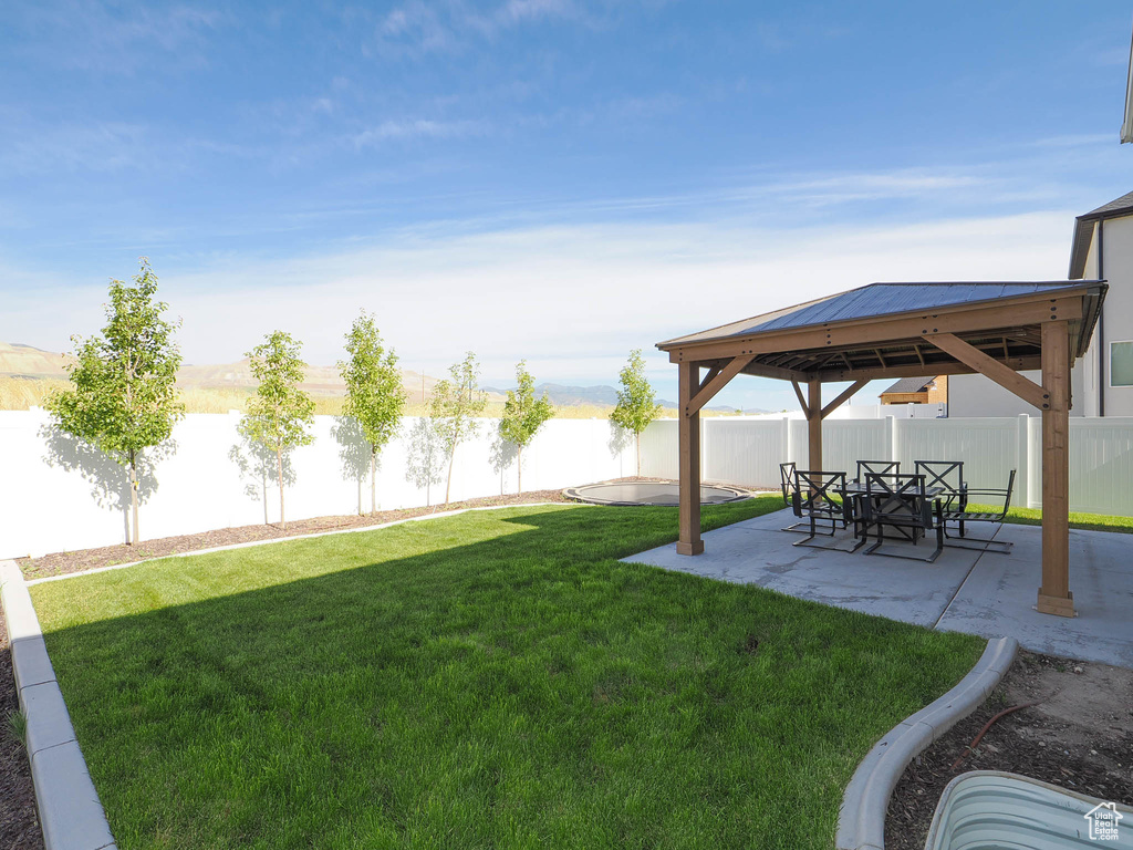 View of yard with a patio area and a gazebo