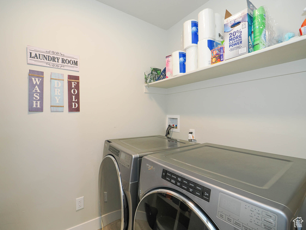 Clothes washing area with washer and dryer and washer hookup