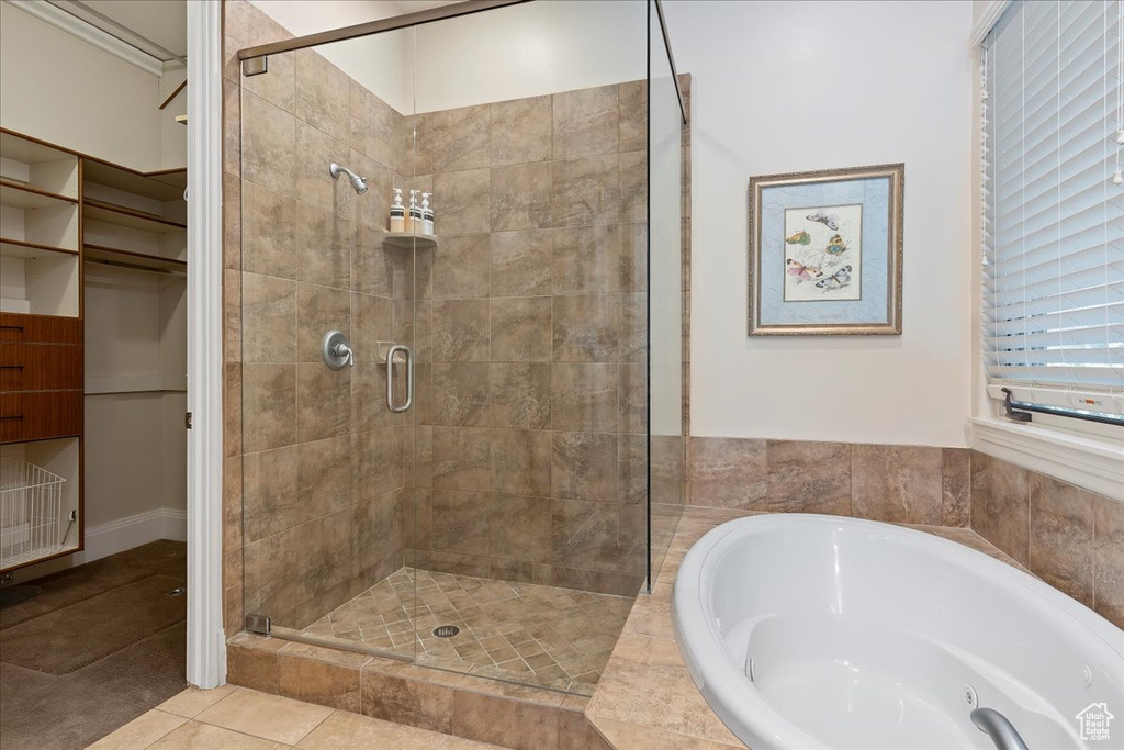 Bathroom with tile floors and separate shower and tub