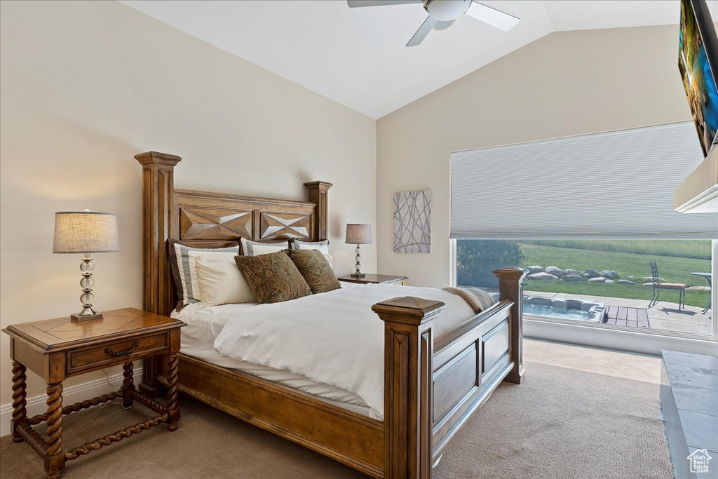 Bedroom with vaulted ceiling, carpet, and ceiling fan