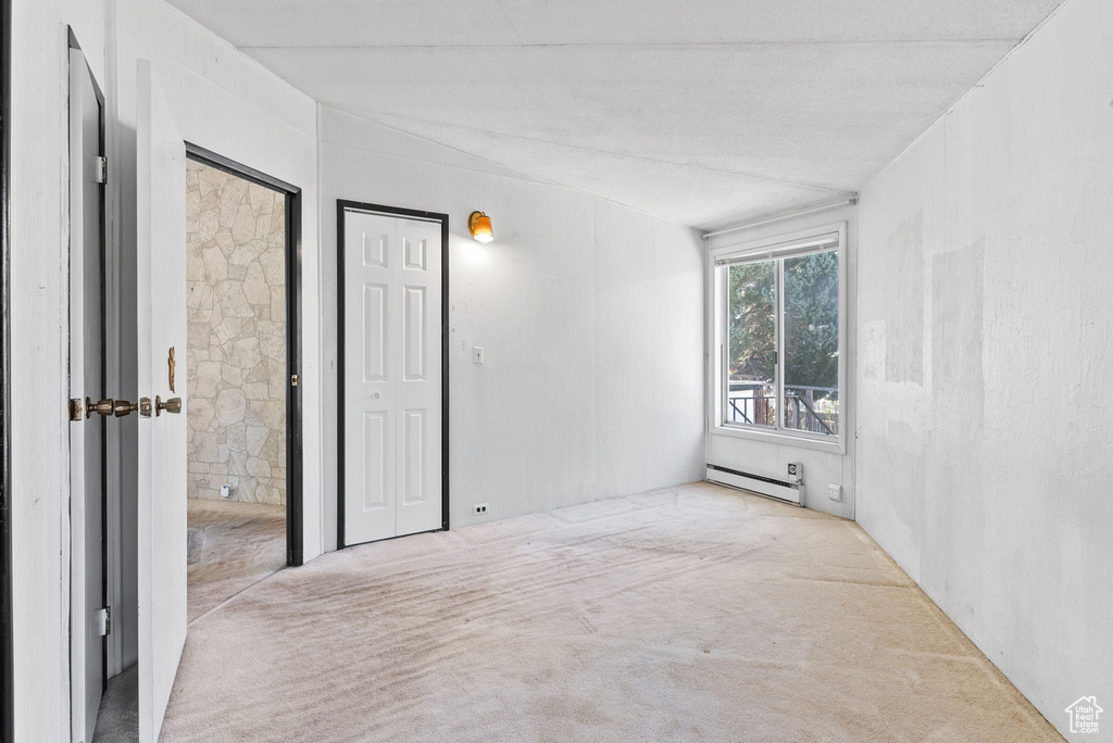 Interior space featuring baseboard heating and a textured ceiling